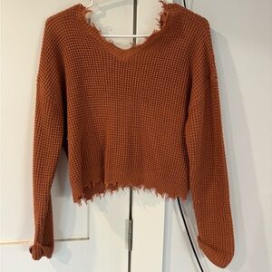 Darker orange sweater
